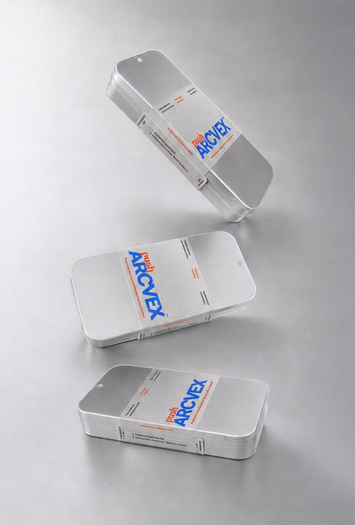Three silver rectangular boxes with blue and orange 'MONEY' branding, arranged diagonally on a reflective light gray surface.